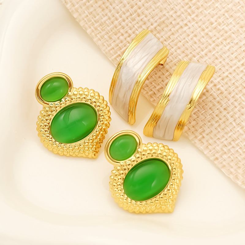 Opal stainless steel women's gold plated stud earrings with green oval stones and textured gold frame