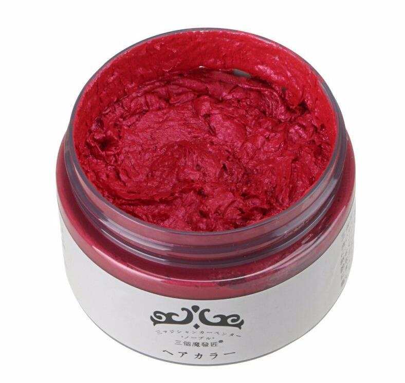Red hair color wax in open container for one-time dyeing hair application