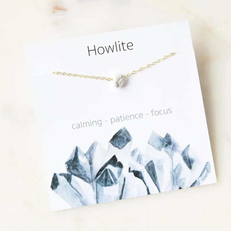 Howlite stone pendant necklace on a card with 'calming, patience, focus' text, showcasing bohemian style.