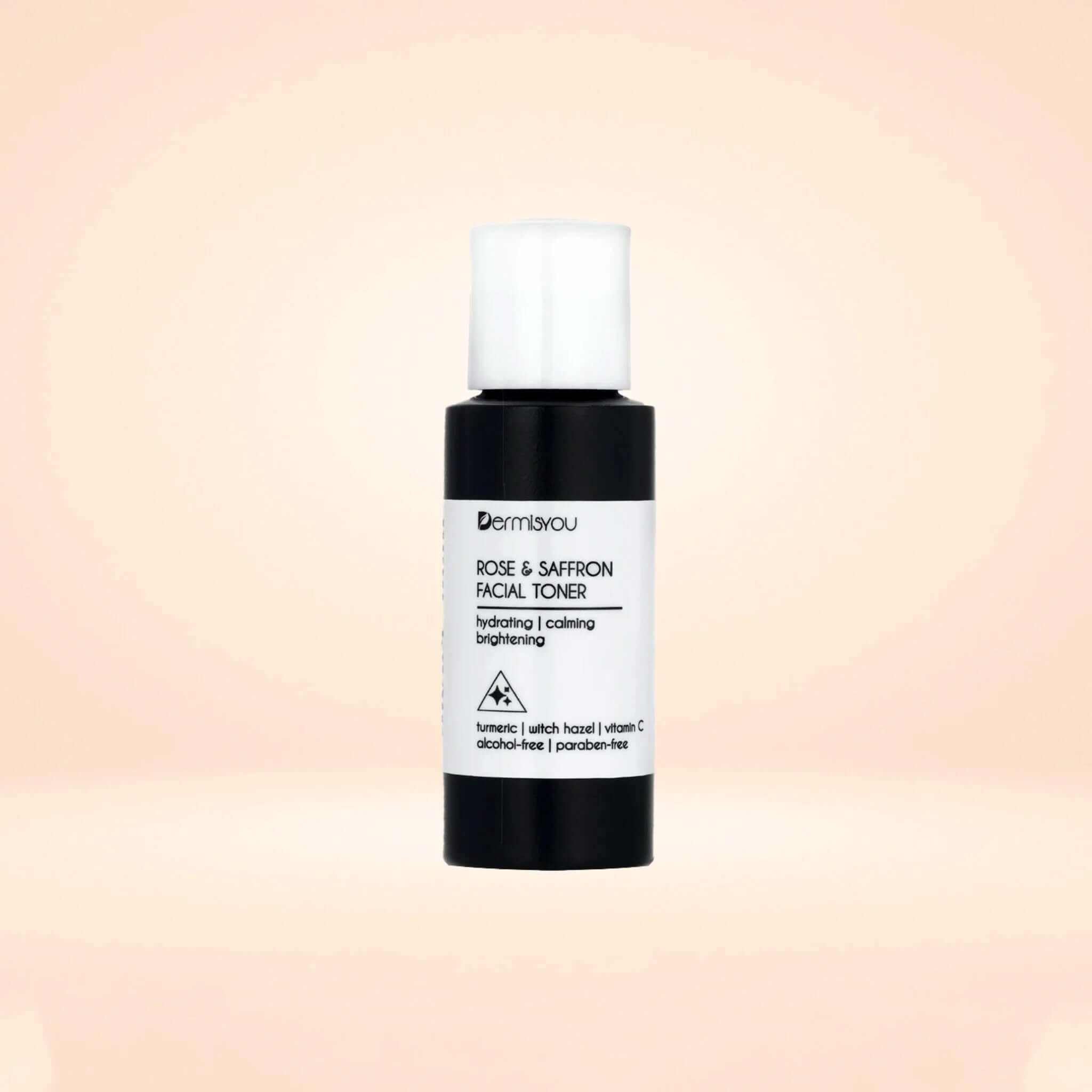 Hydrating Cleansing Saffron Rose Water Facial Toner in a sleek bottle against a soft pink background.