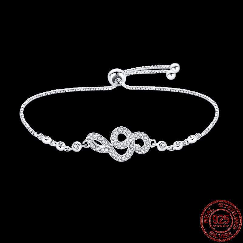 Infinity Hamsa sterling silver bracelet with adjustable chain and crystal embellishments on black background