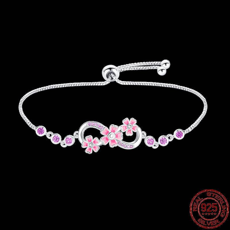 Infinity Hamsa sterling silver bracelet with pink flower accents and adjustable chain