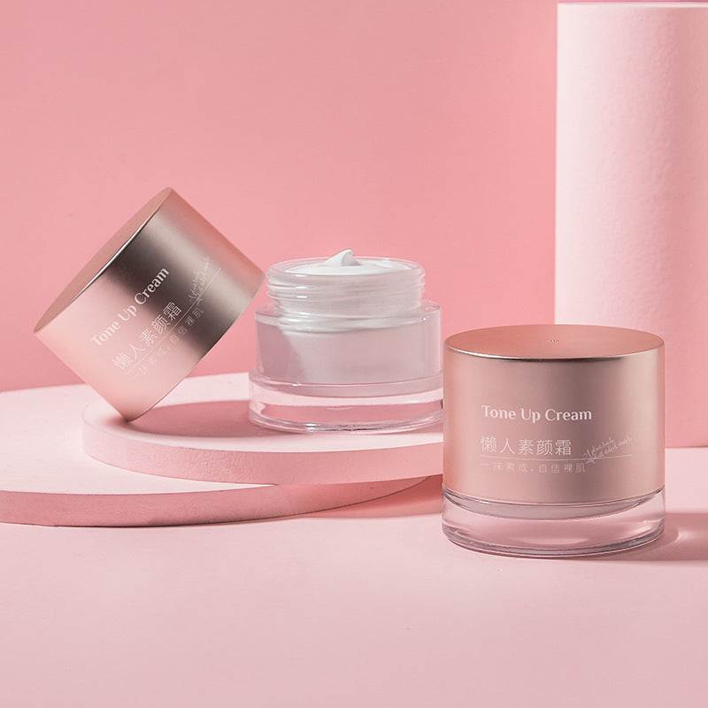Intense Moisturizing Natural Core Cream in rose gold jars on pink background