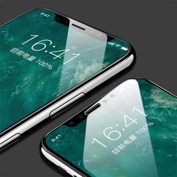 Close-up of two iPhones displaying a screen protector with digital clock and battery percent.