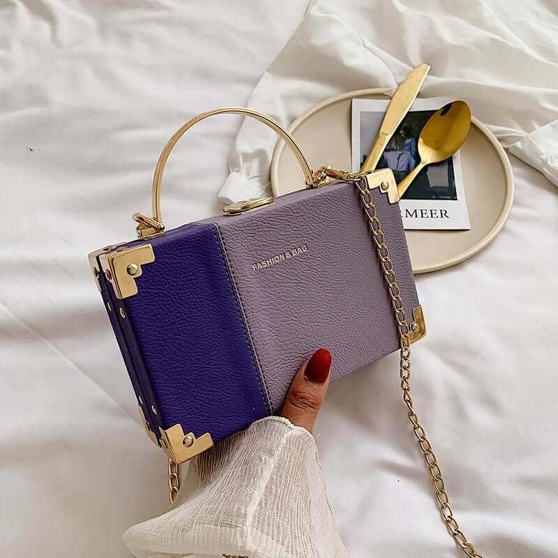 Elegant ladies handle clutch purse in purple and gray, perfect for stylish party looks.
