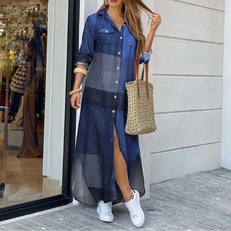 Ladies long shirt dress in denim with a button-down front, styled with a woven tote bag and sneakers.