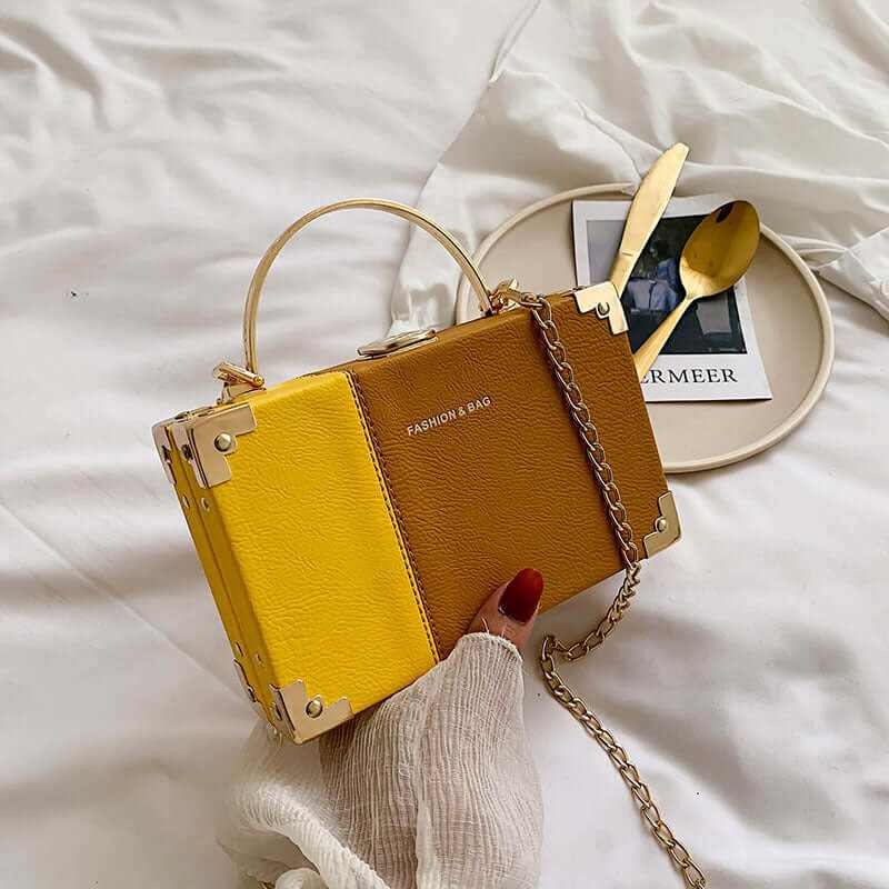 Elegant yellow and brown handle clutch purse box, perfect for stylish parties and events.