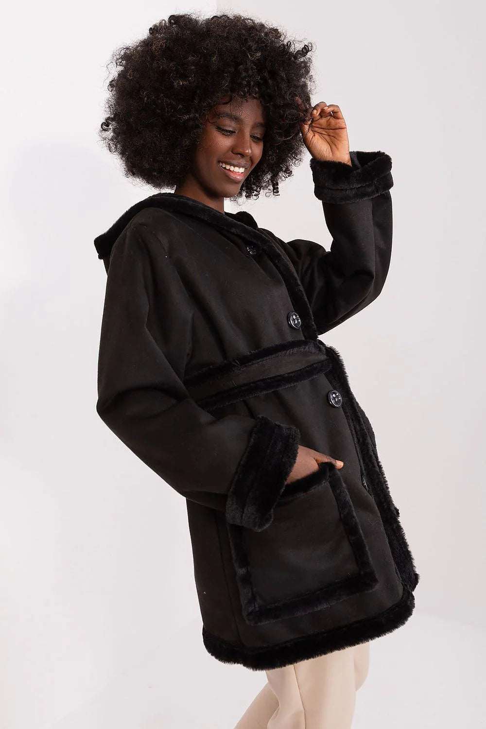 Lakerta minimalist women's fashion coat in black, featuring a spacious hood and stylish design, perfect for winter.