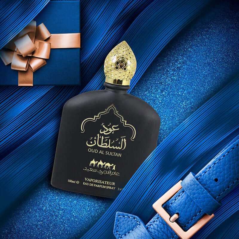 long-lasting Middle Eastern perfume bottle Oud Al Sultan on blue textured background with gift box and belt