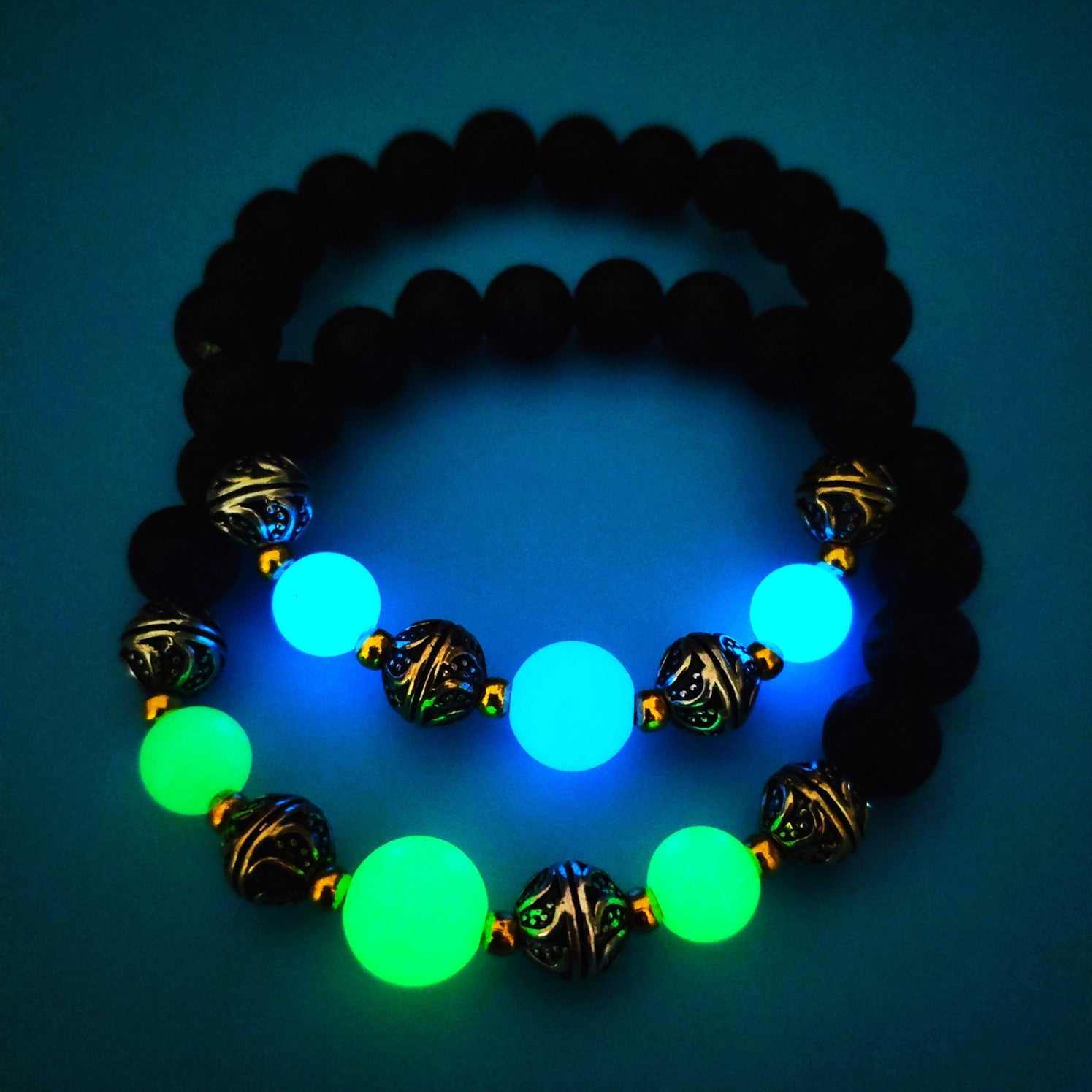 Luminous beaded bracelet for women with glowing green and blue beads and antique bronze accents