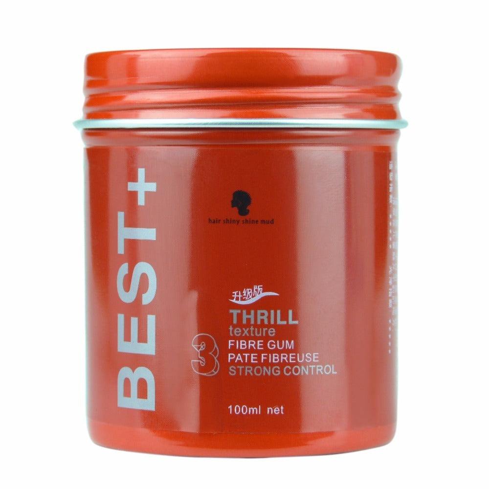 Matte styling hair mud in orange container for natural textured hair shaping