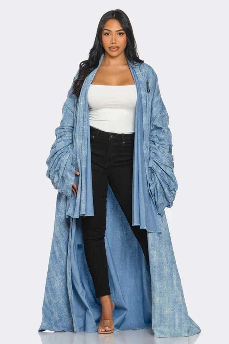Model wearing a Maxi Longline Denim Duster Coat with ruched sleeves over a white top and black pants.