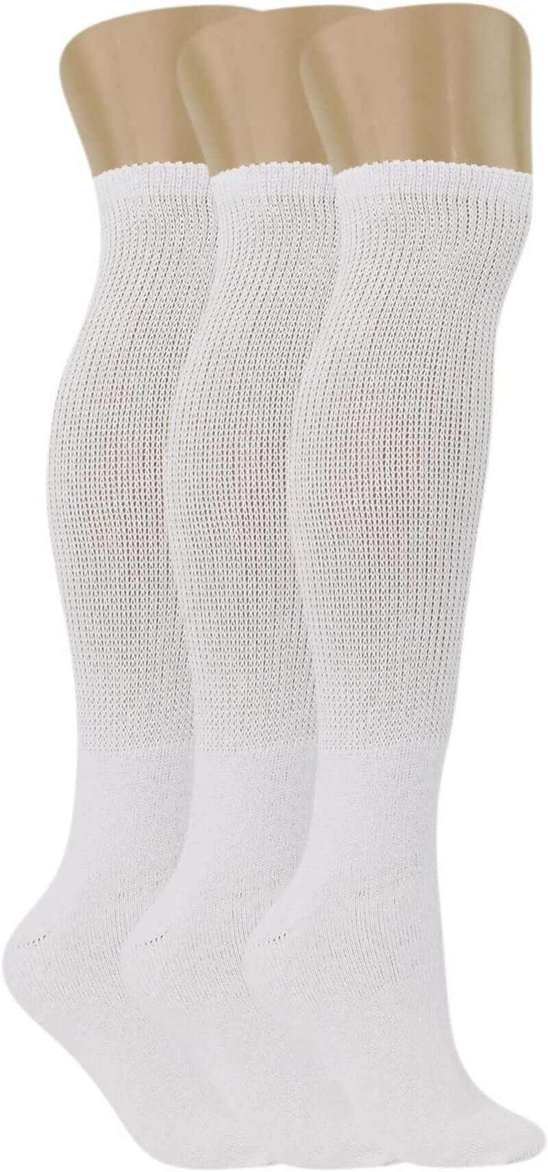Three pairs of white men's diabetic knee-high socks with wide non-binding tops for improved circulation and comfort.