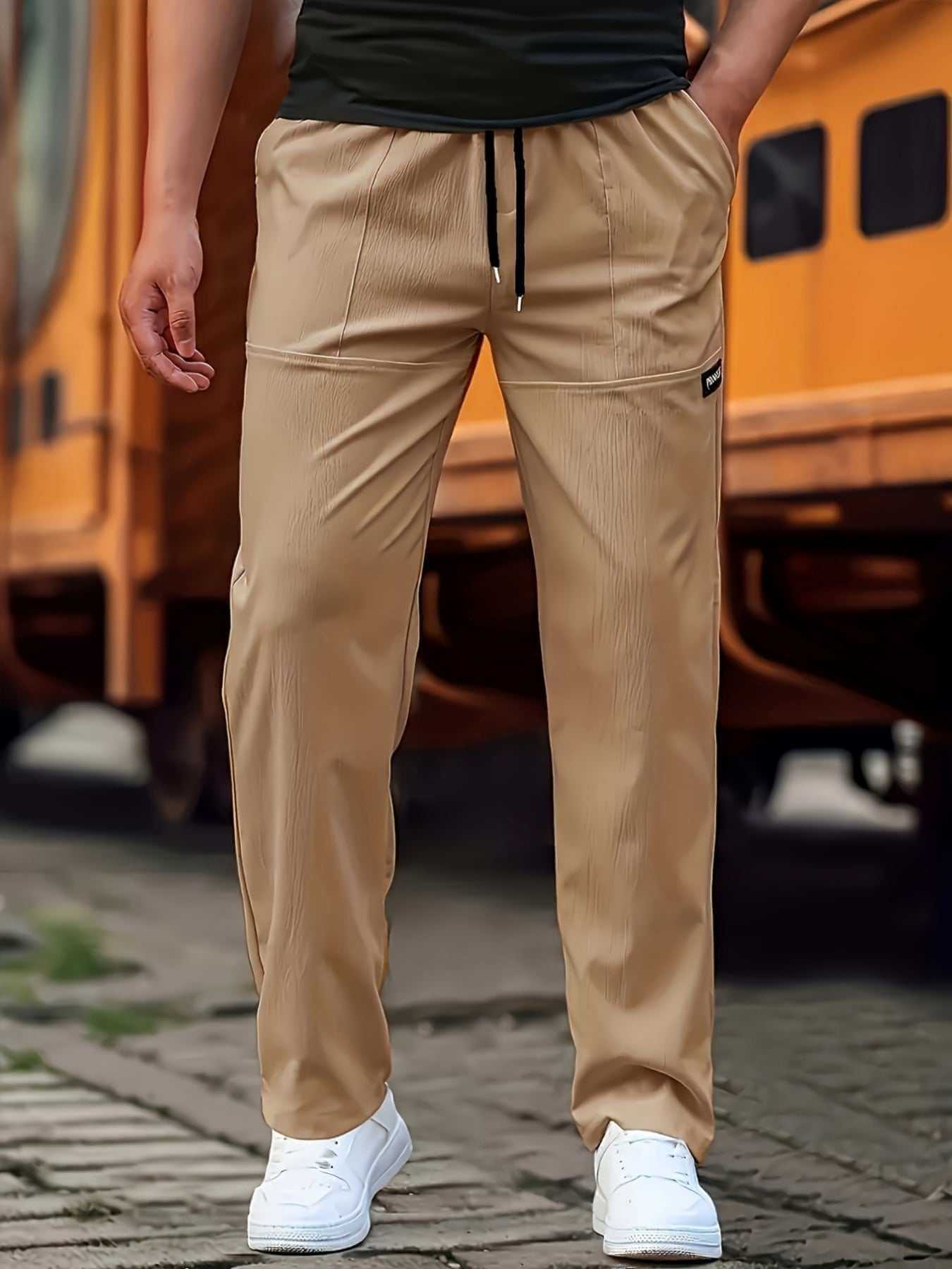 Men's fashion sweatpants beige casual with drawstring and white sneakers