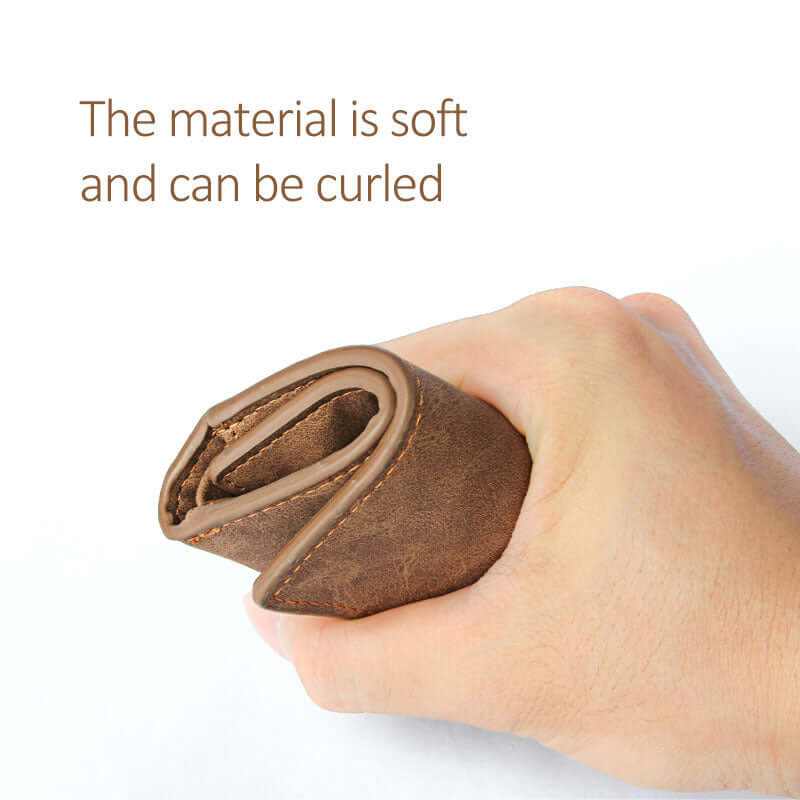 Hand holding a soft, curled Men’s Slim Compact Pocket Small Money Wallet showcasing its flexible leather material.