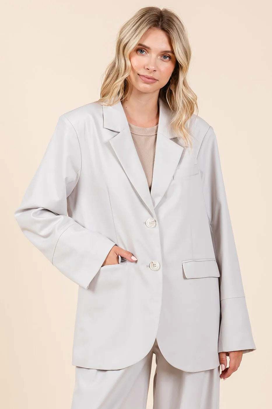 Stylish woman wearing a Mittoshop Boyfriend Fit Blazer Jacket in light gray, showcasing an oversized relaxed fit.