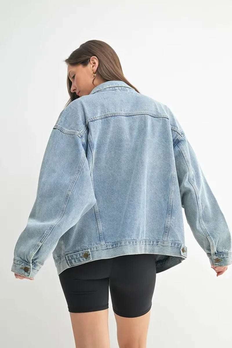 Back view of a stylish MONO B boxy-cut denim jacket, showcasing its relaxed fit and modern design.