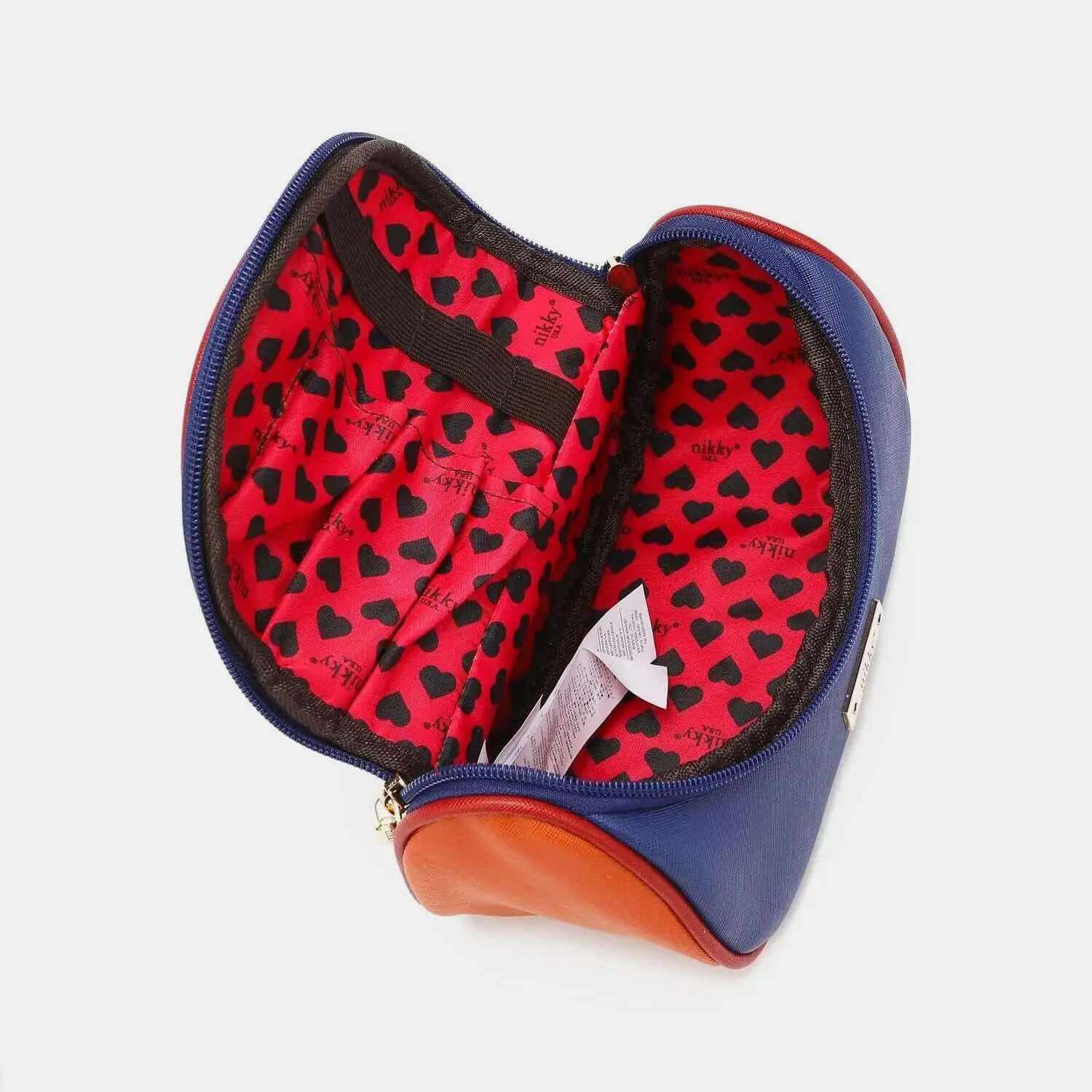 Nicole Lee USA Nikky Contrast makeup bag with blue and brown vegan leather exterior and red heart-patterned interior lining