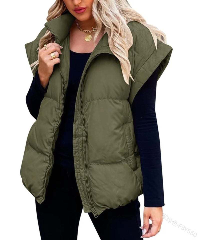 Stylish green puffer vest on a model, designed for warmth and comfort, perfect for layering in cool weather.