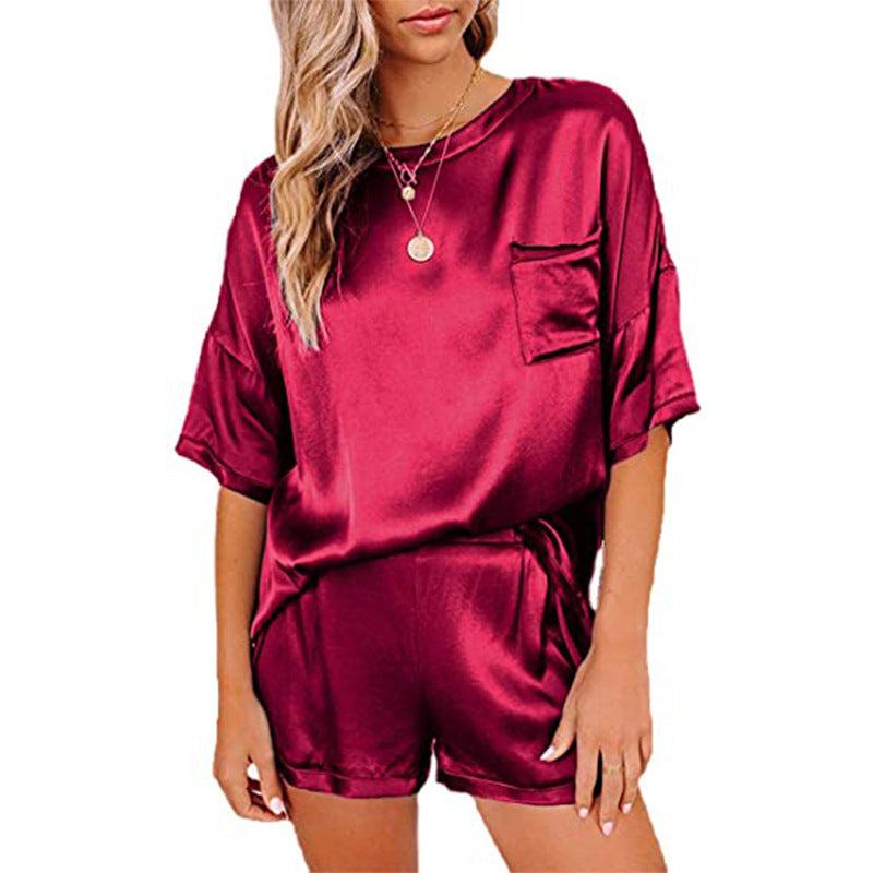 Maroon short sleeve pajama set for women featuring a T-shirt and shorts, made of silk blend fabric.