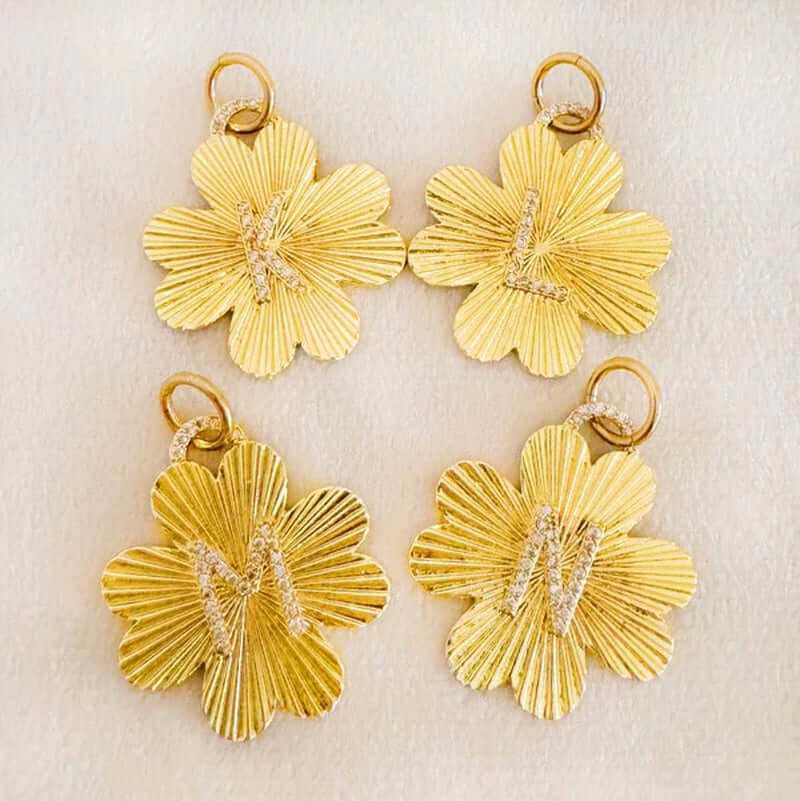 Personalized lucky clover charm clips with initials K, L, M, N in gold, perfect for jewelry accessories.
