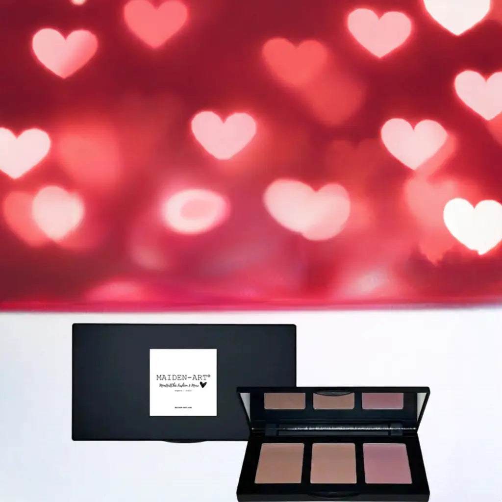 Pinch-Tone Blush Palette displayed against a dreamy heart background, showcasing three shades for a radiant glow.