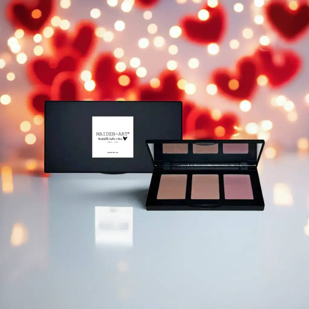 Pinch-Tone Blush Palette for Cheeks on a reflective surface with bokeh heart lights in background.