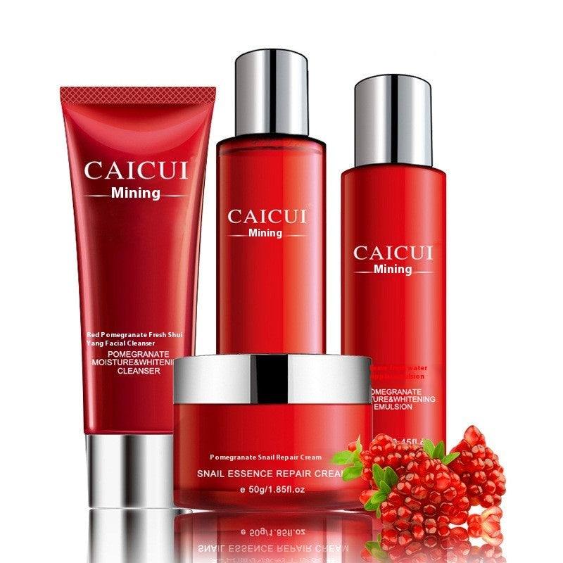 Pomegranate Set moisturizing cosmetics with cleanser, toner, lotion, and cream in red packaging with pomegranate fruit.