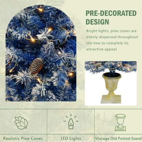 Blue pre-lit artificial Christmas tree set with realistic pine cones and warm white LED lights on vintage potted stand