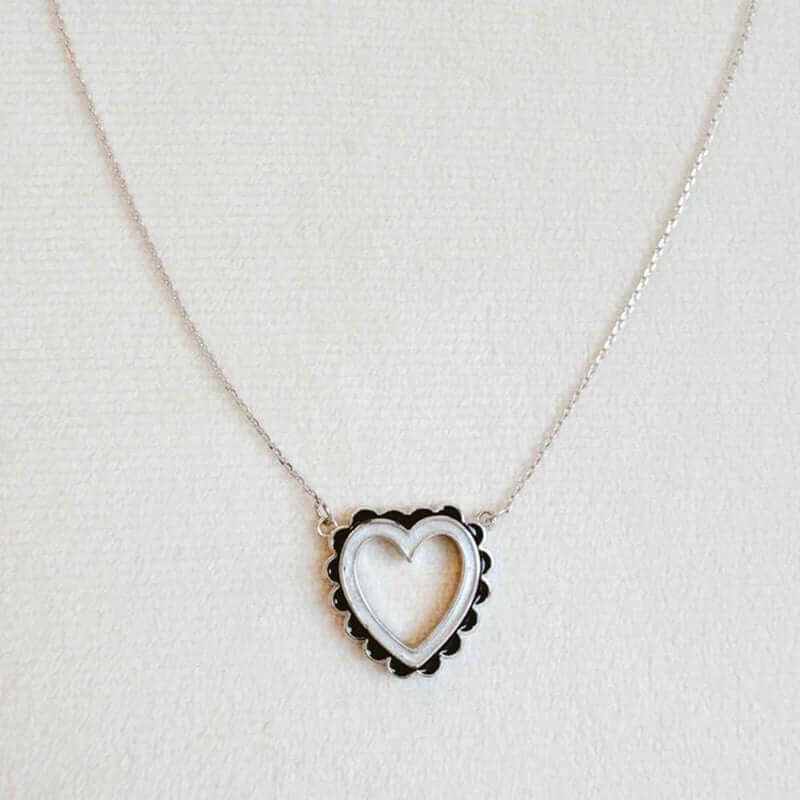 Preciously scallop edged heart necklace featuring a unique heart design on a delicate chain, 18k gold plated.