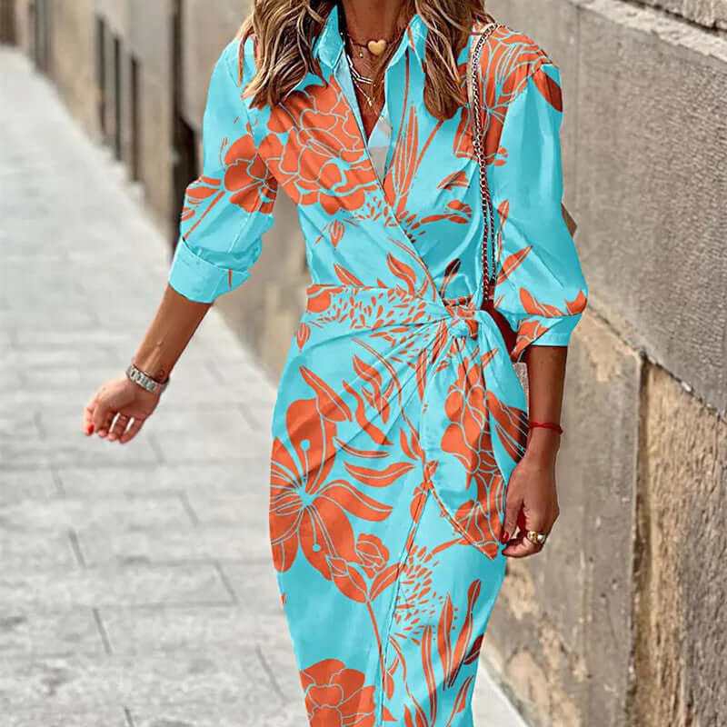 Fashion printed shirt dress in blue with orange floral design, featuring three-quarter sleeves and a belt, ideal for stylish women.