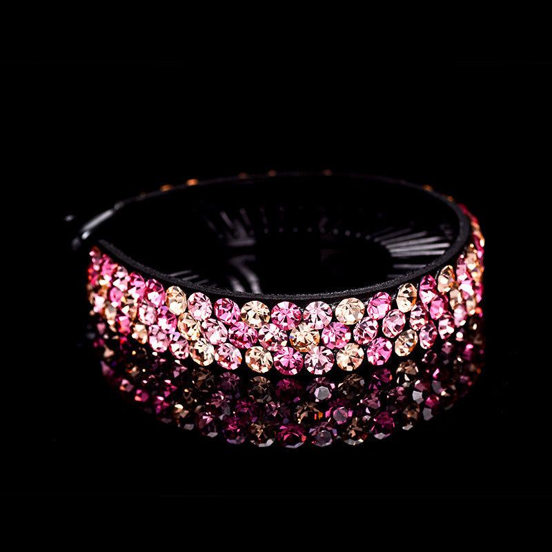Shiny rhinestones hair claw clip decorated with pink and clear gems on black background