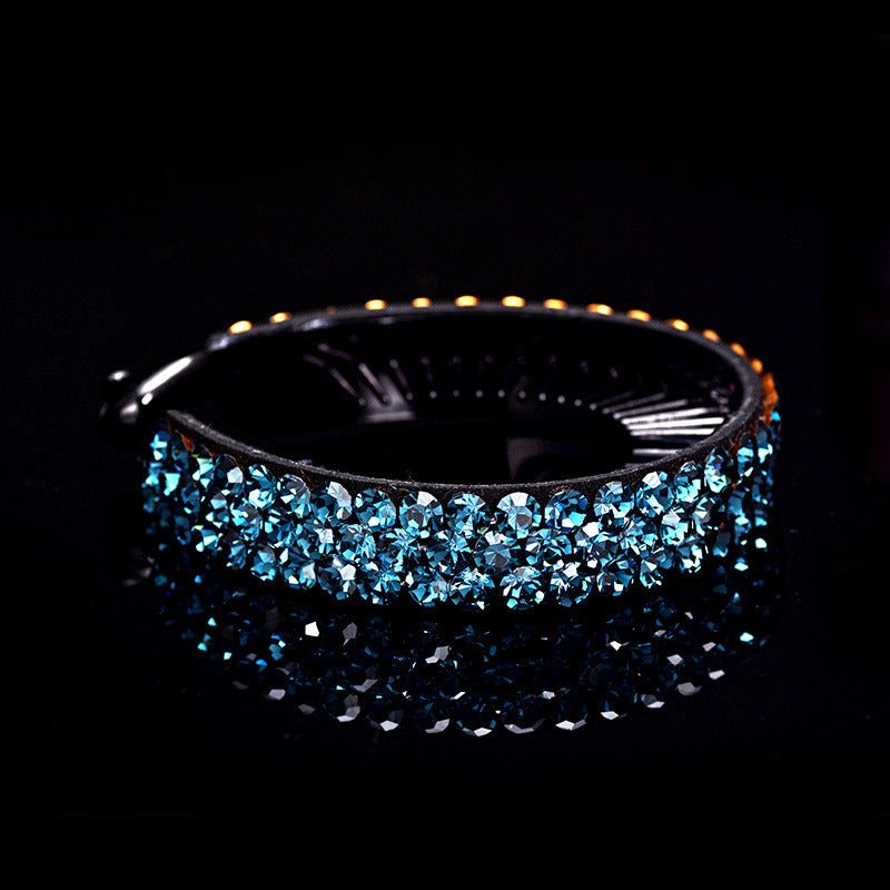 Blue rhinestones hair claw clip with black base on black background