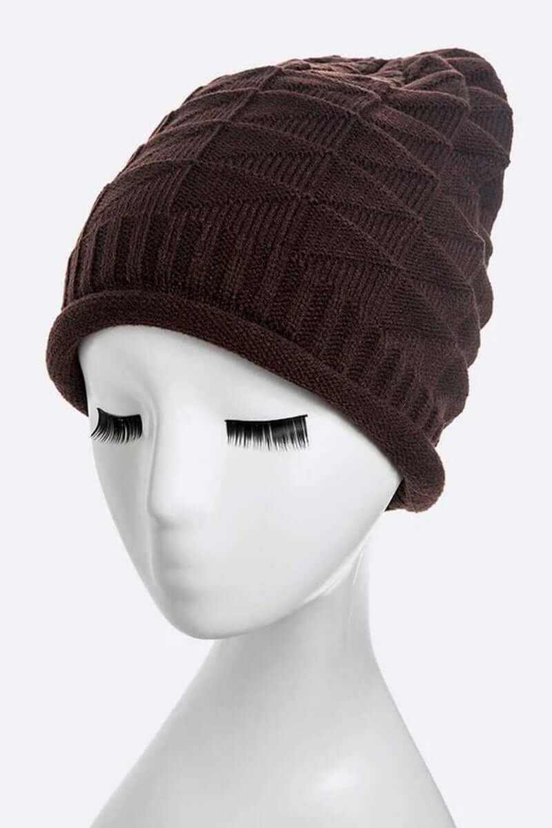Ribbed slouchy unisex raised knit slouchy beanie in dark brown on a mannequin head.