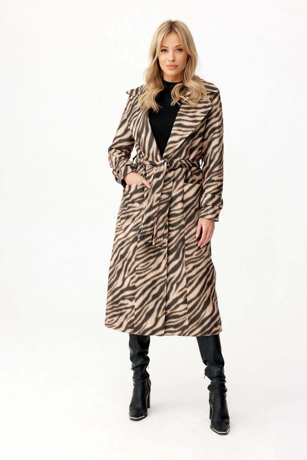 Woman wearing a stylish Roco Fashion Wool Blend Coat with a zebra pattern and a belted waist.