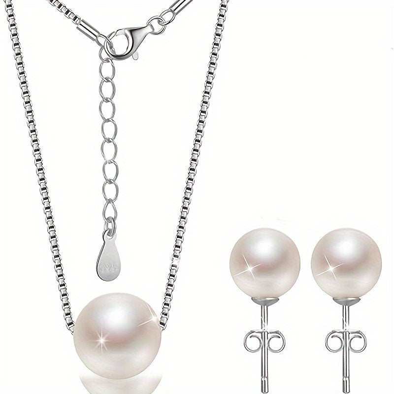 Elegant romantic Valentine's gift necklace featuring a single high-luster pearl and silver-tone stud earrings.