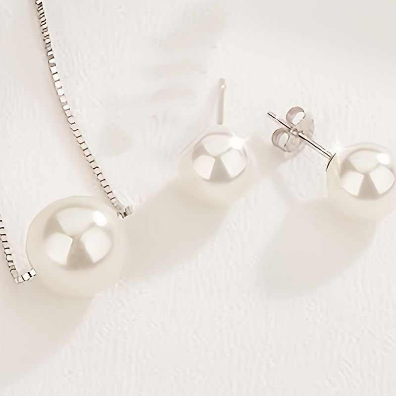 Elegant pearl necklace and earring set in silver, featuring high-luster glass pearls perfect for Valentine's gifts.