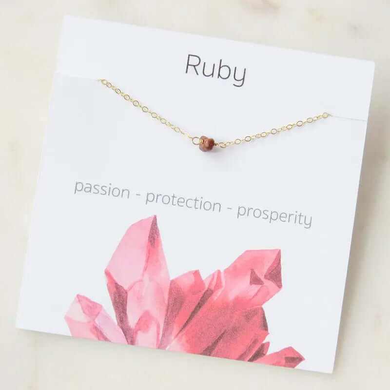 Boho ruby gemstone necklace on display with text highlighting passion, protection, and prosperity.