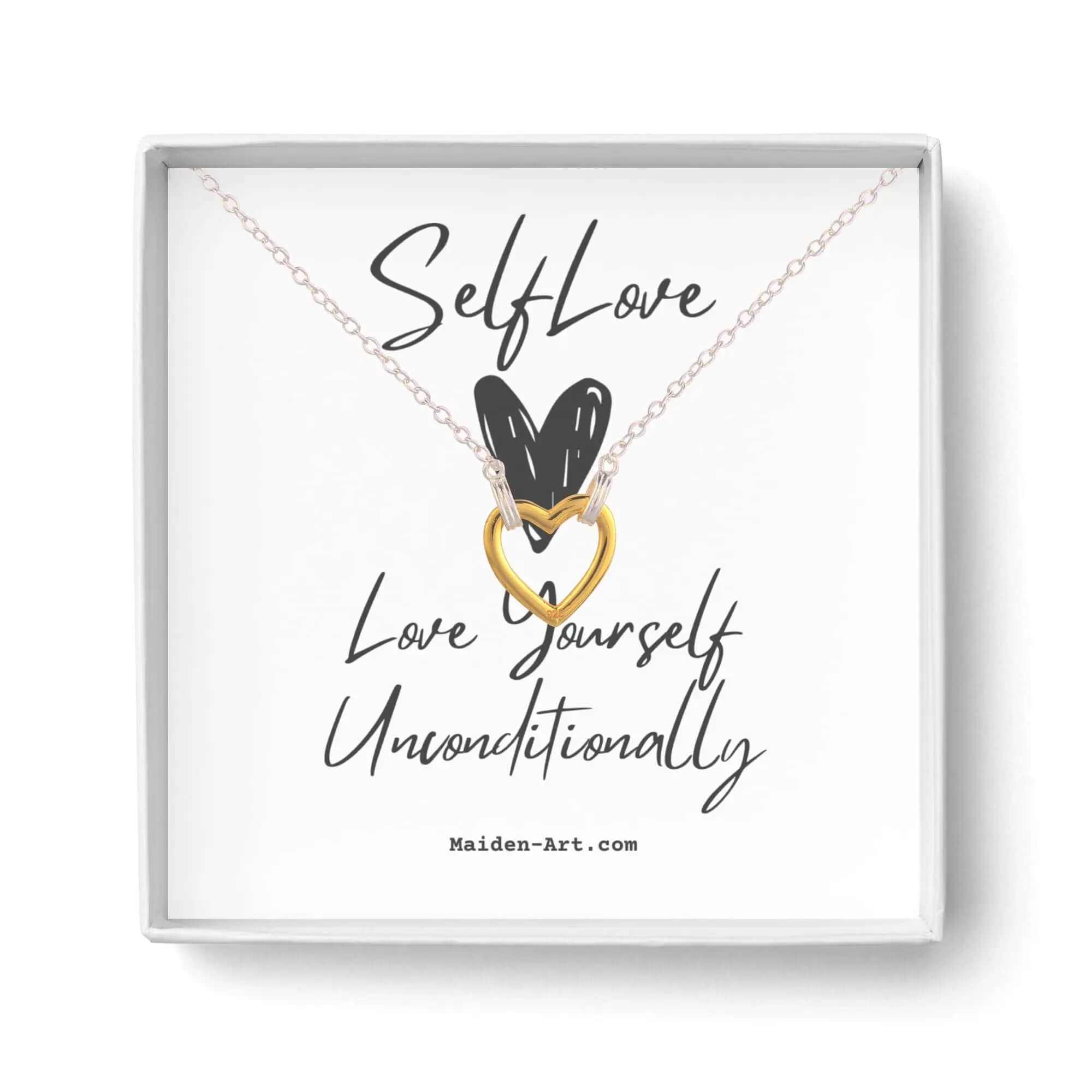 Self-love necklace in gift box featuring gold heart pendant with text 'Love Yourself Unconditionally'.
