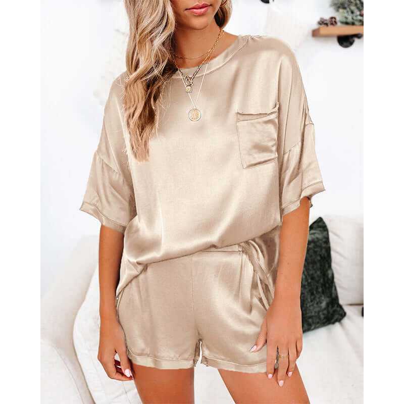 Elegant satin pajama set for women in beige, featuring a short sleeve T-shirt and comfy shorts, perfect for leisure wear.