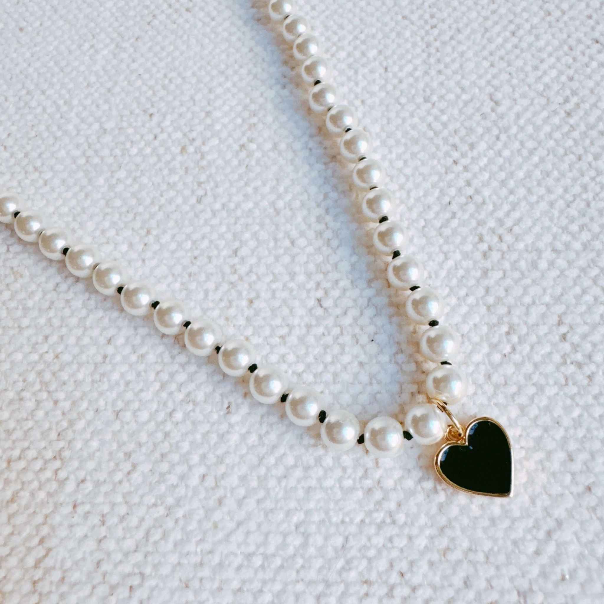 Silky Adjustable Thread Heart Pendant Necklace featuring glass pearls and a charming gold heart pendant.