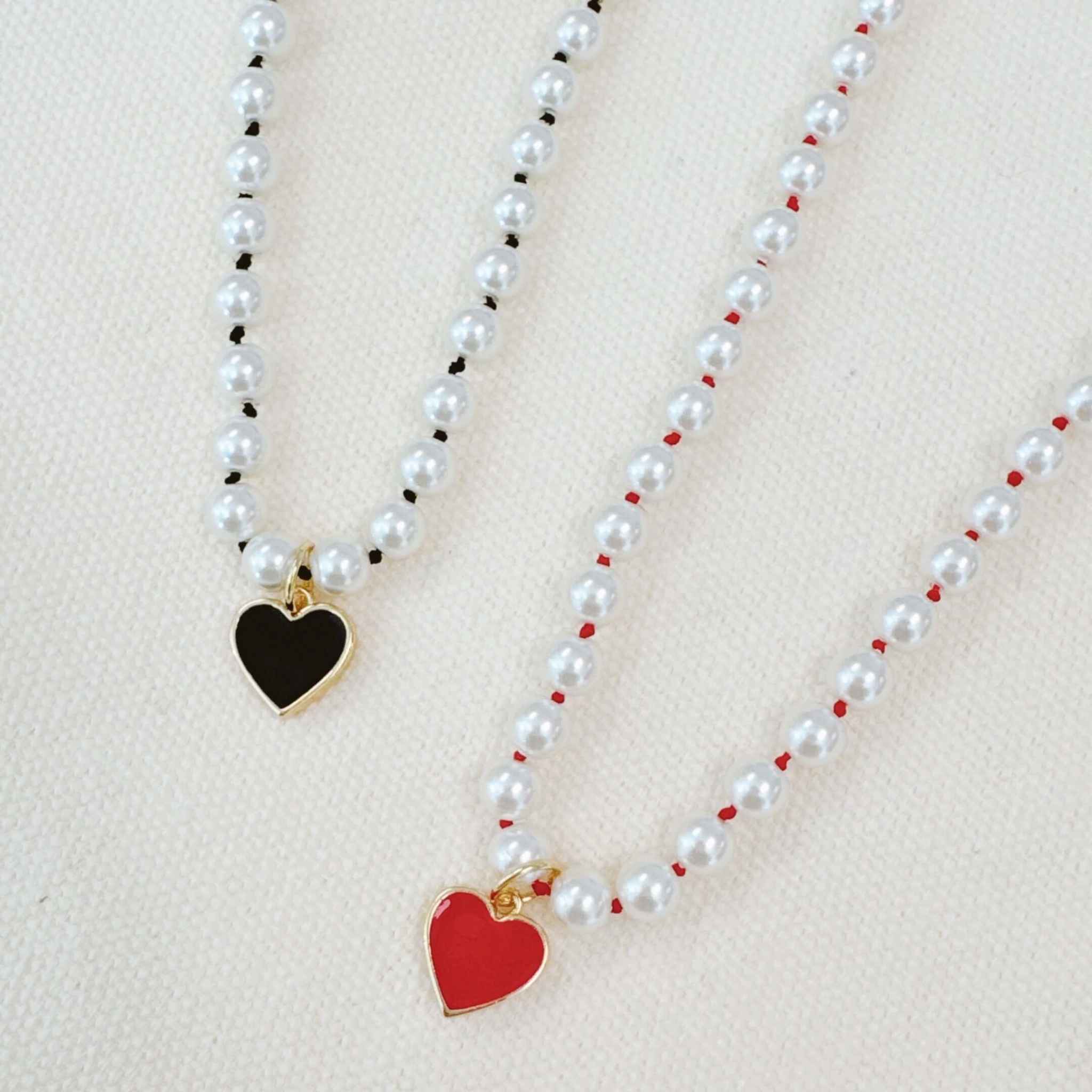 Silky Adjustable Thread Heart Pendant Necklaces in black and red, adorned with glass pearls for a chic look.