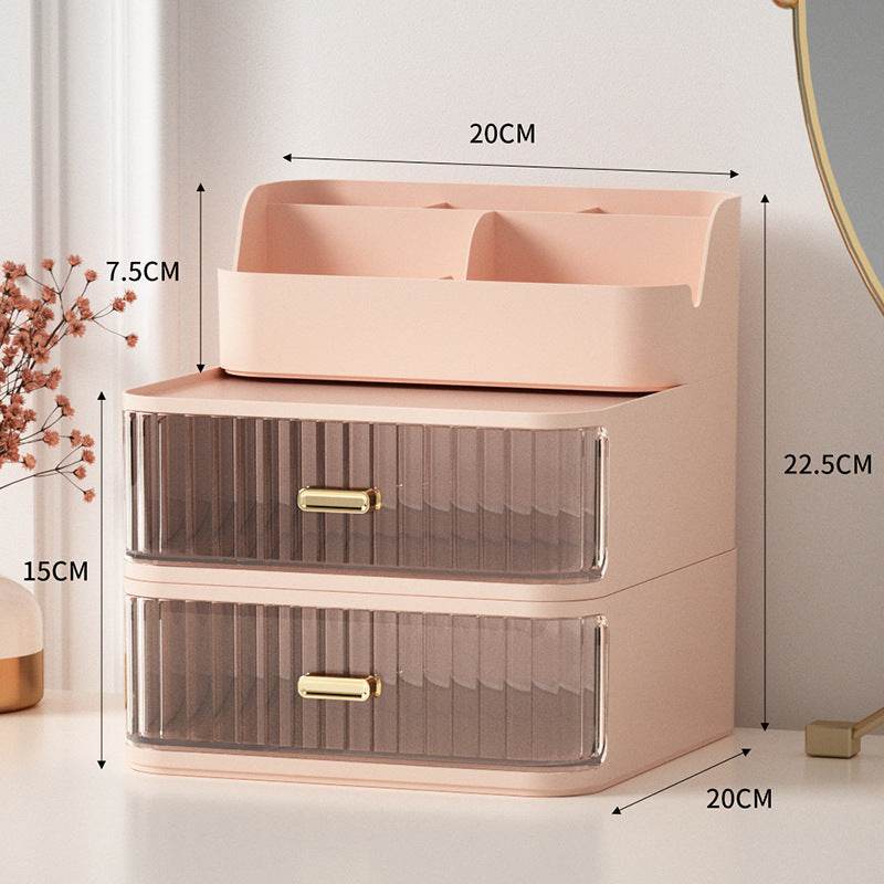 Pink space-saving vanity storage box with two transparent drawers and top compartments for organizing makeup accessories