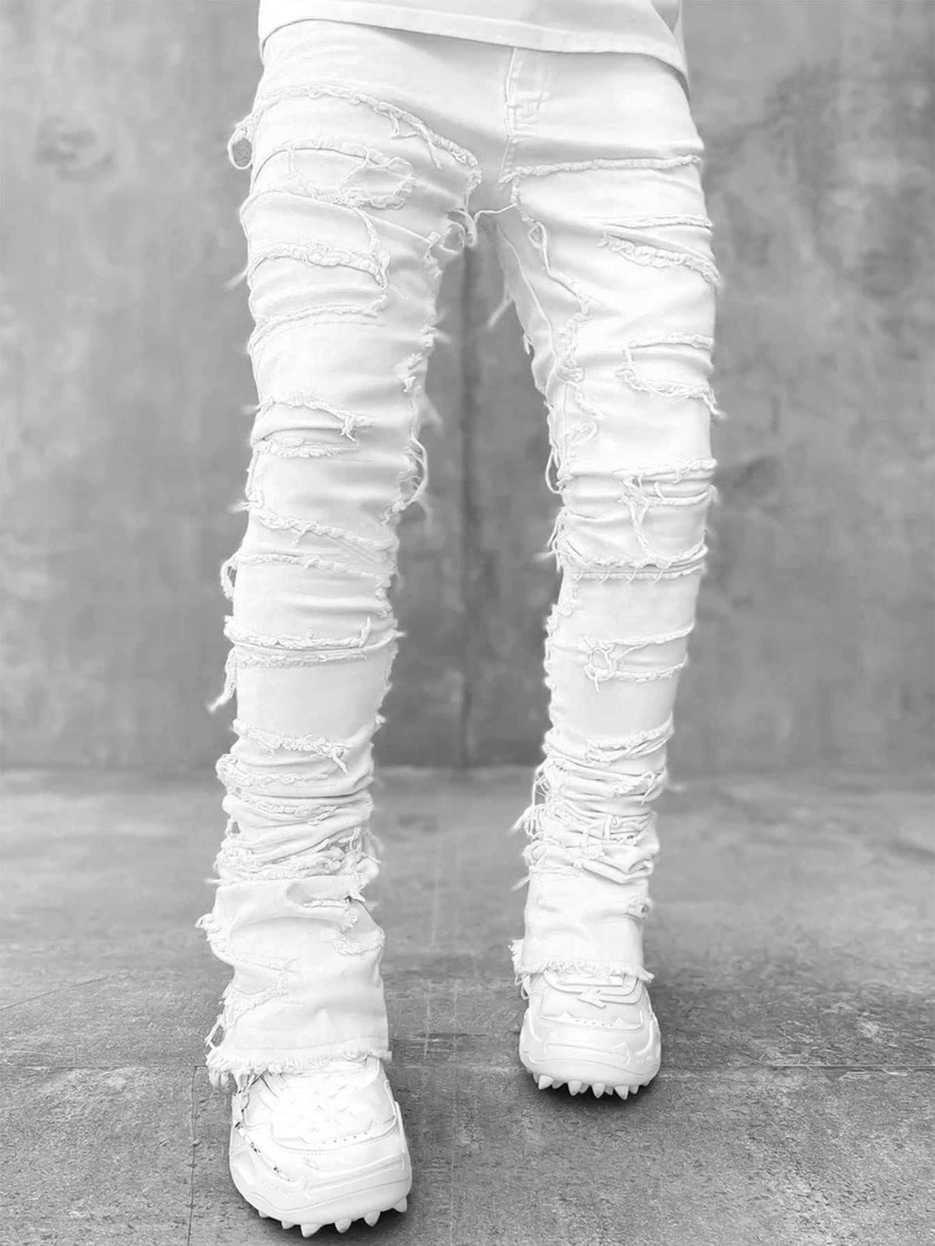 White stacked jeans for men with distressed design and frayed edges in comfortable cotton fabric