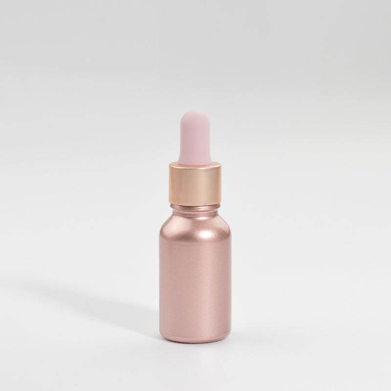 Rose gold glass dropper bottle with pink rubber top for cosmetics dispensing
