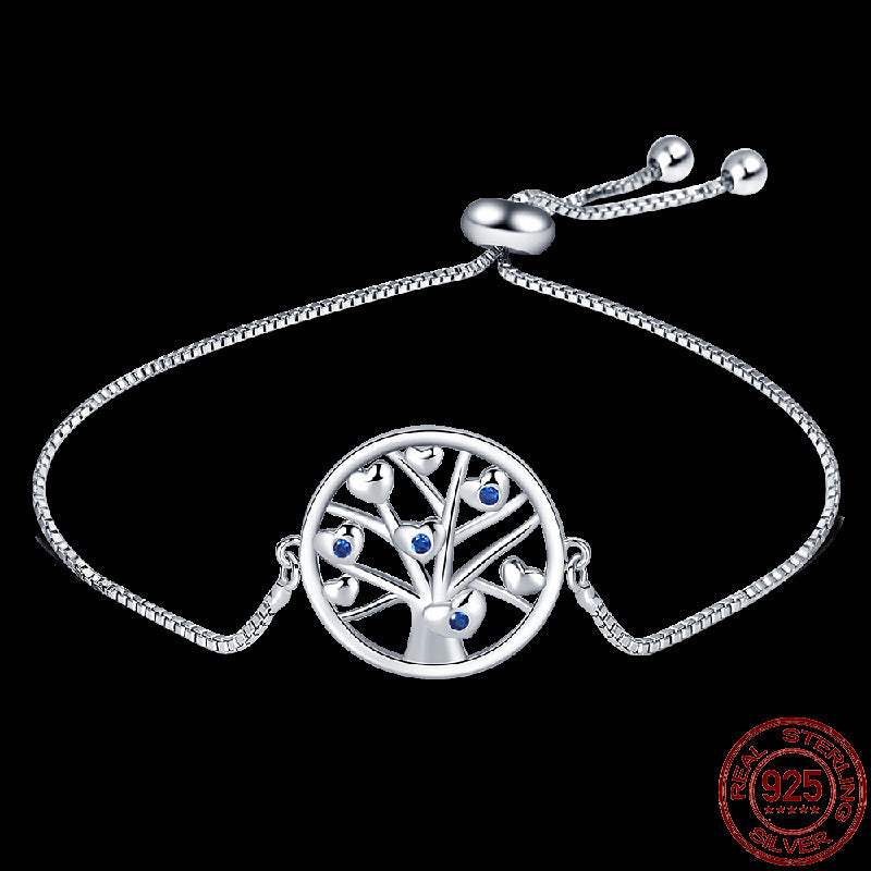 Infinity Hamsa sterling silver bracelet with tree design and blue gemstone accents on adjustable chain