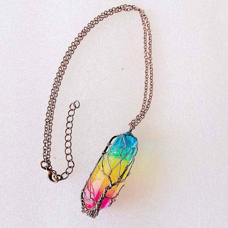 Stylish stone crystal pillar Tree of Life pendant necklace with colorful gradient design.