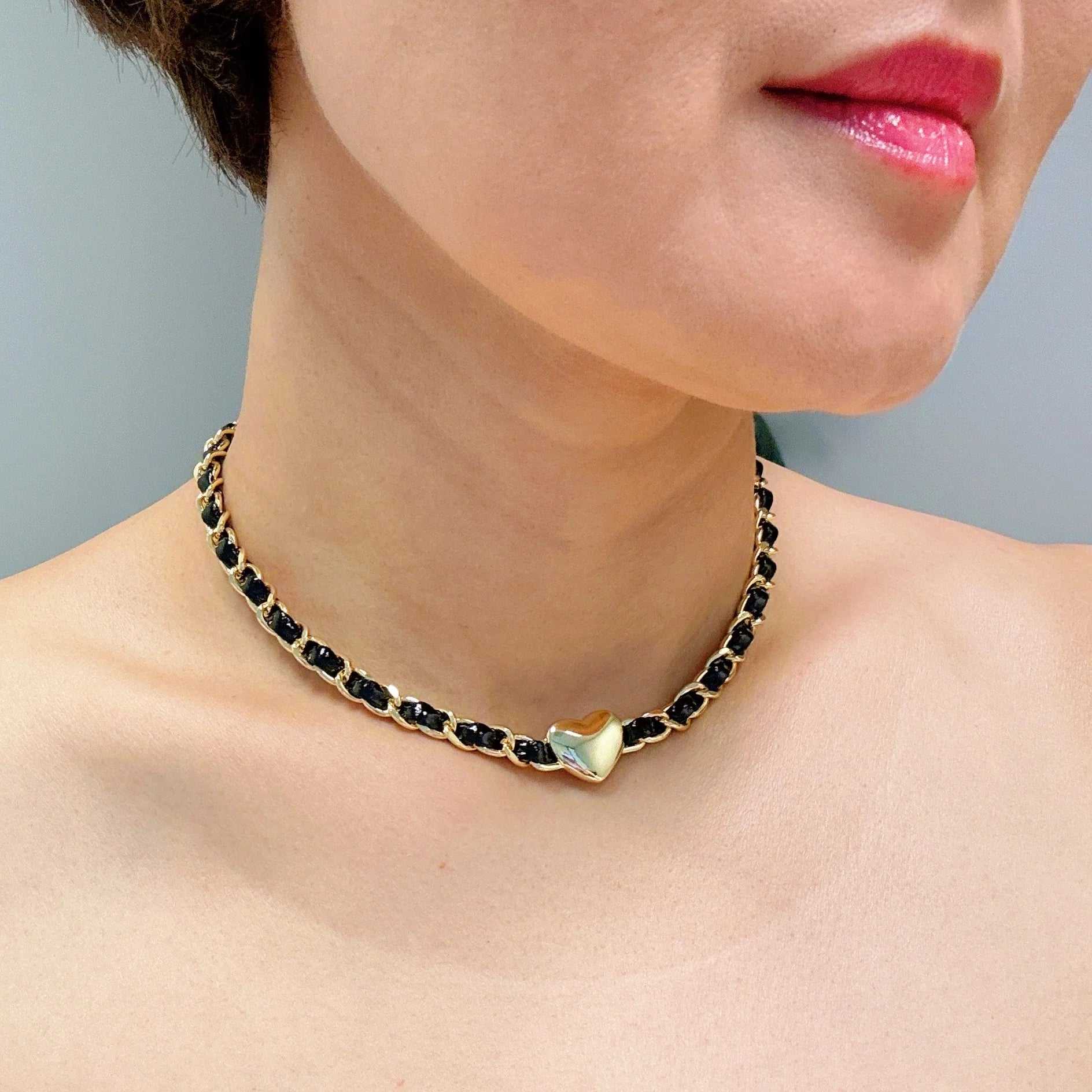 Edgy Heart Chain Choker Necklace worn by a model, featuring a unique heart design and black links.