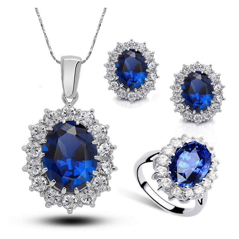 Bridal crystal jewelry set with blue sapphire and clear crystals necklace, earrings, and ring