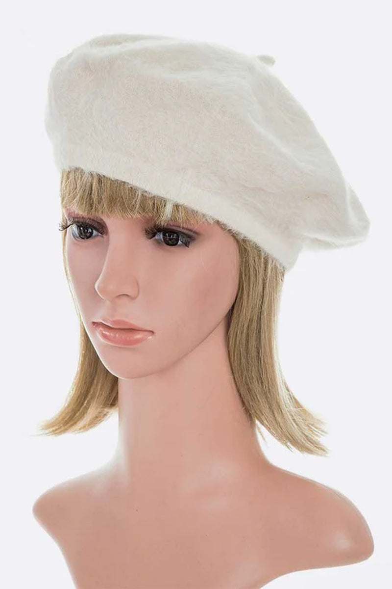 Stylish faux fur winter beret displayed on a mannequin, showcasing a chic and elegant design for a cozy look.